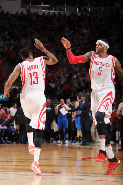 HOUSTON, TX - APRIL 21: James Harden #13 high fives Josh Smith #5 of the Houston Rockets after a play against the Dallas Mavericks during Game Two of the Western Conference Quarterfinals of the 2015 NBA Playoffs on April 21, 2015 at the Toyota Center in Houston, Texas. (Photo by Bill Baptist/NBAE via Getty Images)