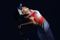 Wang Qiang of China serves to Coco Gauff of the U.S. during their first round match at the Australian Open tennis championships in Melbourne, Australia, Monday, Jan. 17, 2022. (AP Photo/Hamish Blair)