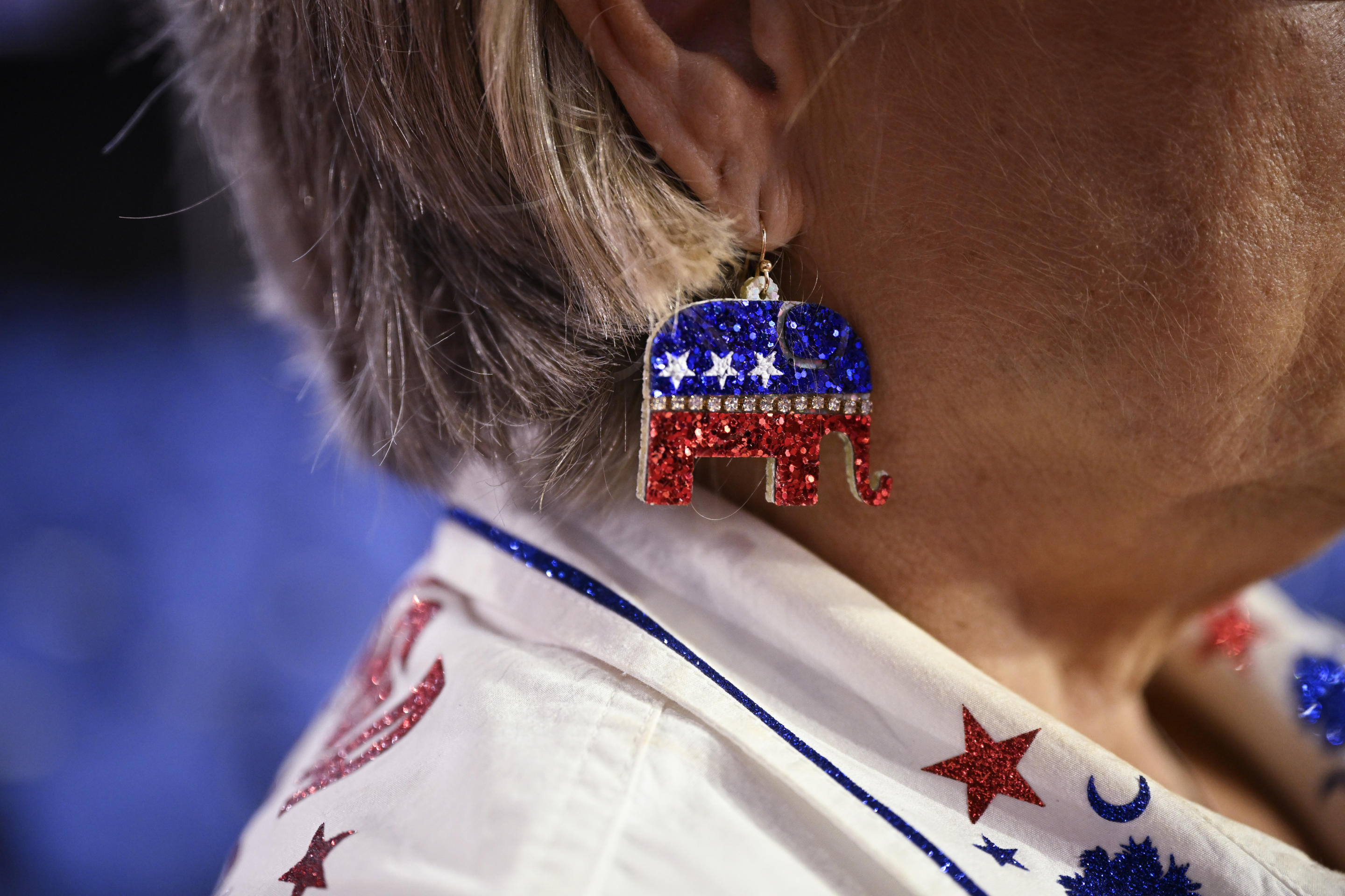 A woman wears earrings with the Republican Party's elephant logo on the first day of the Republican National Convention in Milwaukee. (Leon Neal/Getty Images)