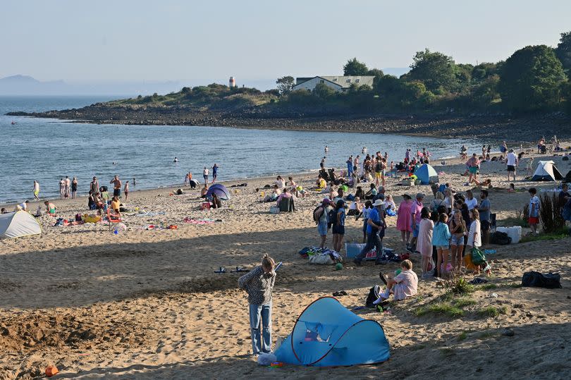 People enjoy the hot, sunny weather.