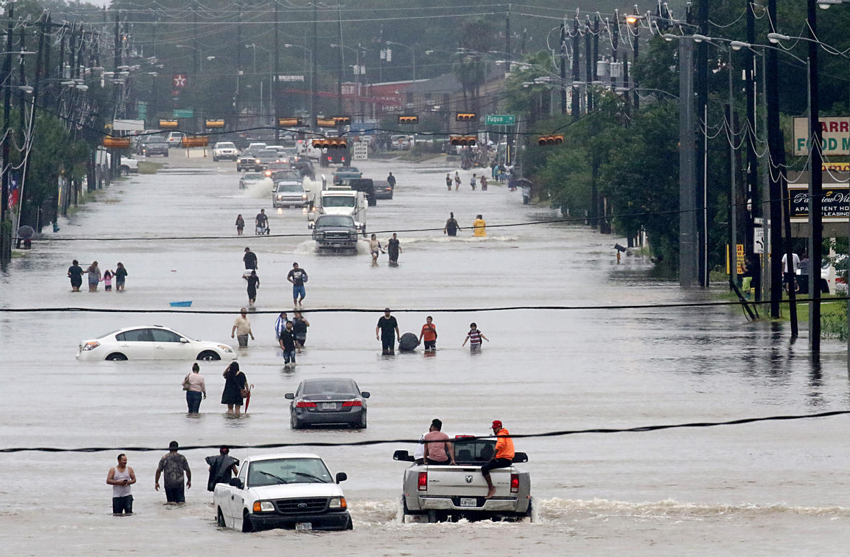 People make their way down flooded Telephone Road in Houston in August 2017.