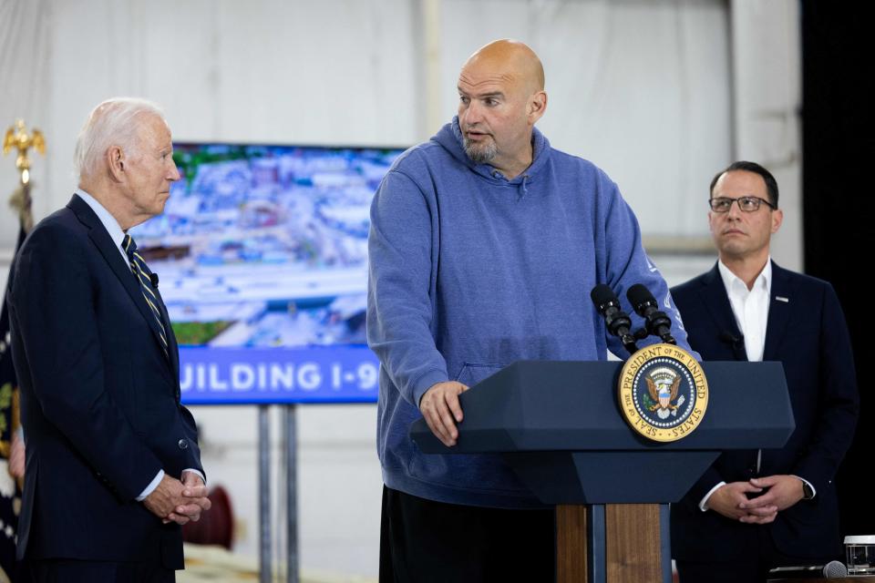 President Biden and Pennsylvania Gov. Josh Shapiro look on as Sen. John Fetterman, D-Penn., delivers remarks following a briefing on Interstate-95 highway emergency repair and reconstruction efforts, in Philadelphia, Pennsylvania, on June 17, 2023. / Credit: JULIA NIKHINSON/AFP via Getty Images