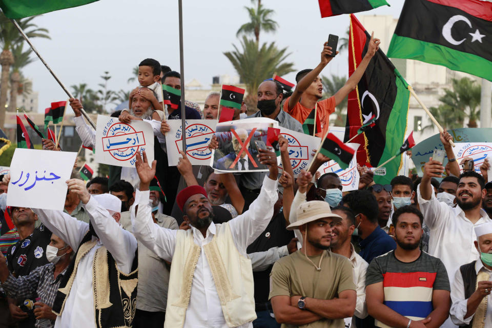 Hundreds of demonstrators protest in Tripoli, Libya, on Friday, Sept. 24, 2021, in opposition to the country’s parliament passing a vote of no-confidence in the transitional government. The motion, passed on Tuesday, represents a challenge to planned December elections and impedes efforts to unite the oil-rich North African nation after a decade of turmoil. (AP Photo/Yousef Murad)