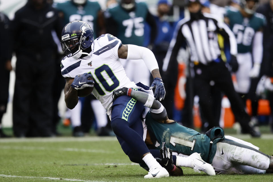 Seattle Seahawks' Josh Gordon (10) is tackled by Philadelphia Eagles' Jalen Mills (31) during the first half of an NFL football game, Sunday, Nov. 24, 2019, in Philadelphia. (AP Photo/Matt Rourke)