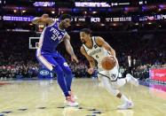 Dec 12, 2018; Philadelphia, PA, USA; Brooklyn Nets guard Spencer Dinwiddie (8) dribbles the ball past Philadelphia 76ers center Joel Embiid (21) during the fourth quarter at Wells Fargo Center. Mandatory Credit: Eric Hartline-USA TODAY Sports