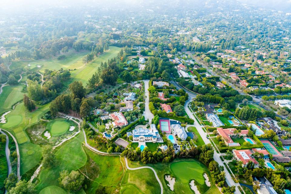 Aerial view of Bel Air Los Angeles neighborhood with mansions and golf course.
