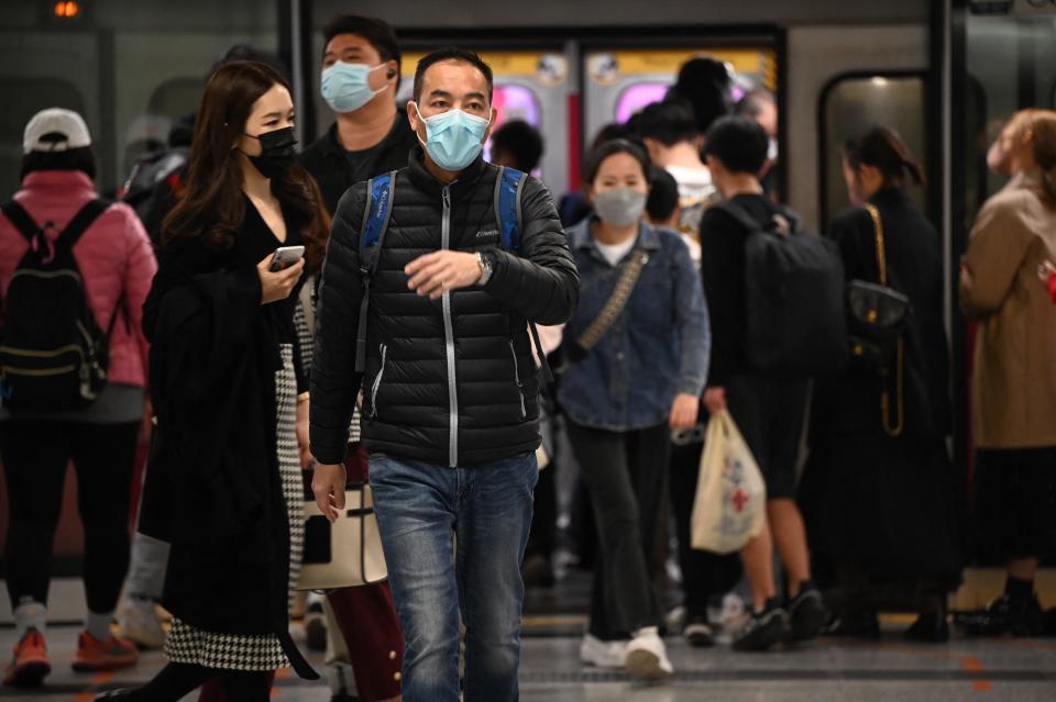 People wear masks on the Mass Transit Railway (MTR) system in Hong Kong on February 27, 2023 as health experts in the territory backed the extension of its mask mandate to March 8 leaving Hong Kong as one of the only places left in the world with such rules. (Photo by Peter PARKS / AFP) (Photo by PETER PARKS/AFP via Getty Images)