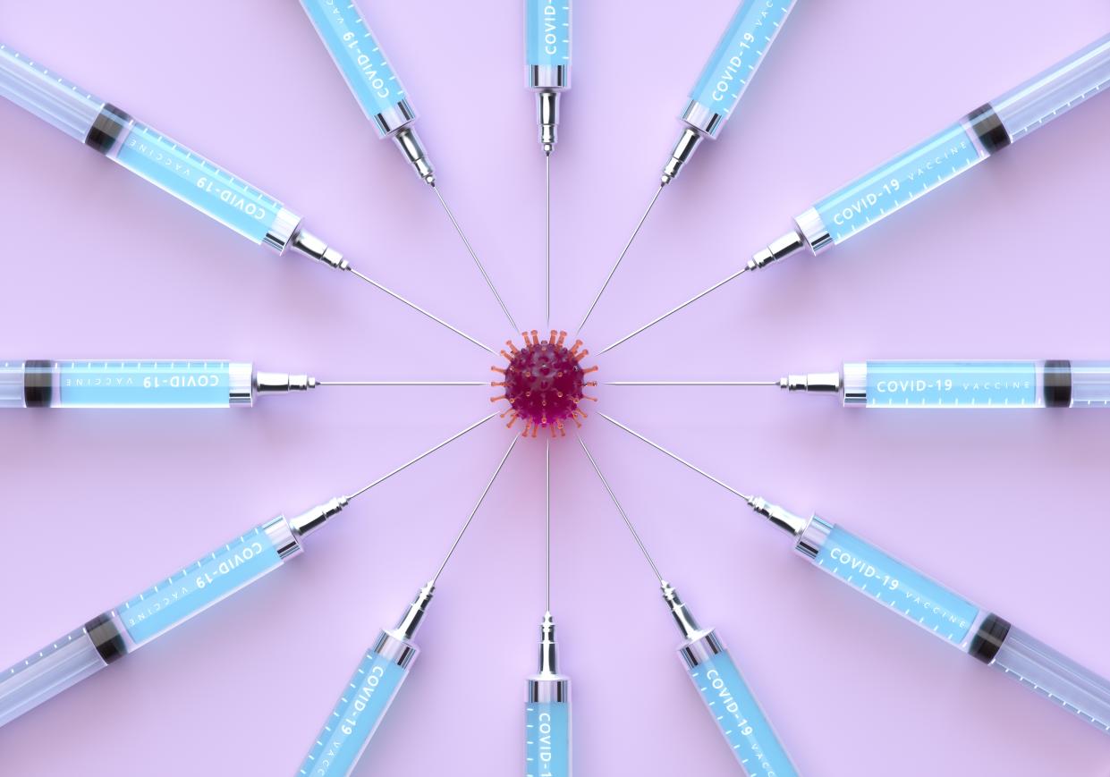 12 hypodermic needles arranged in a starburst pattern around a model of a coronavirus.