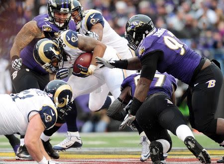 Nov 22, 2015; Baltimore, MD, USA; St. Louis Rams running back Todd Gurley (30) is tackled by Baltimore Ravens linebacker C.J. Mosley (57) at M&T Bank Stadium. The Ravens won 16-13. Mandatory Credit: Evan Habeeb-USA TODAY Sports