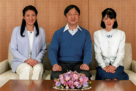 Japan's Crown Prince Naruhito (C) poses for a photo with Crown Princess Masako (L) and their daughter Princess Aiko at Togu Palace in Tokyo, Japan February 12, 2017, in this handout photo released by Imperial Household Agency of Japan. Naruhito celebrates his 57th birthday on February 23, 2017. Imperial Household Agency of Japan via Reuters