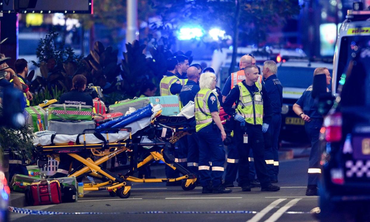 <span>Police and paramedics outside the Westfield Bondi Junction shopping centre in Sydney. Six people have been killed and the injured include a nine-month-old baby.</span><span>Photograph: Steve Markham/AAP</span>