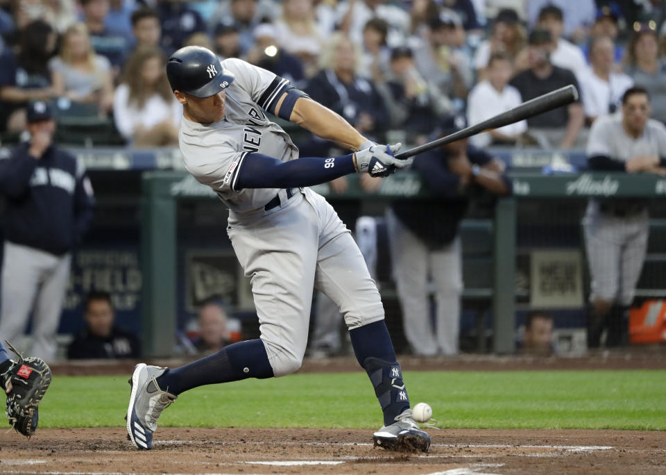 New York Yankees' Aaron Judge singles against the Seattle Mariners in the second inning of a baseball game, Monday, Aug. 26, 2019, in Seattle. (AP Photo/Elaine Thompson)