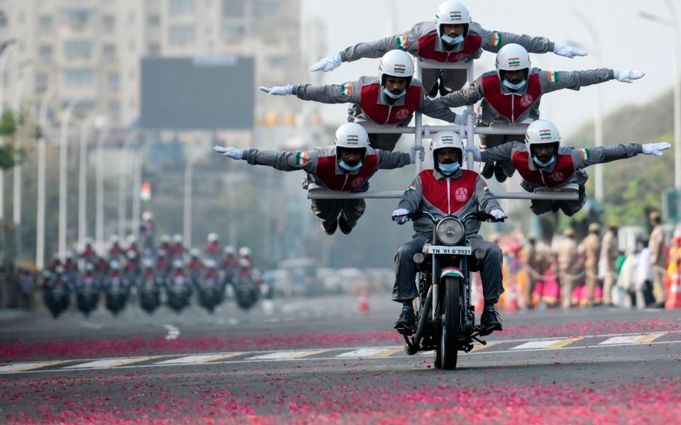 Cadets of Tamilnadu Police perform an acrobatic stunt during a full dress rehearsal for the upcoming Republic Day Parade in Chennai