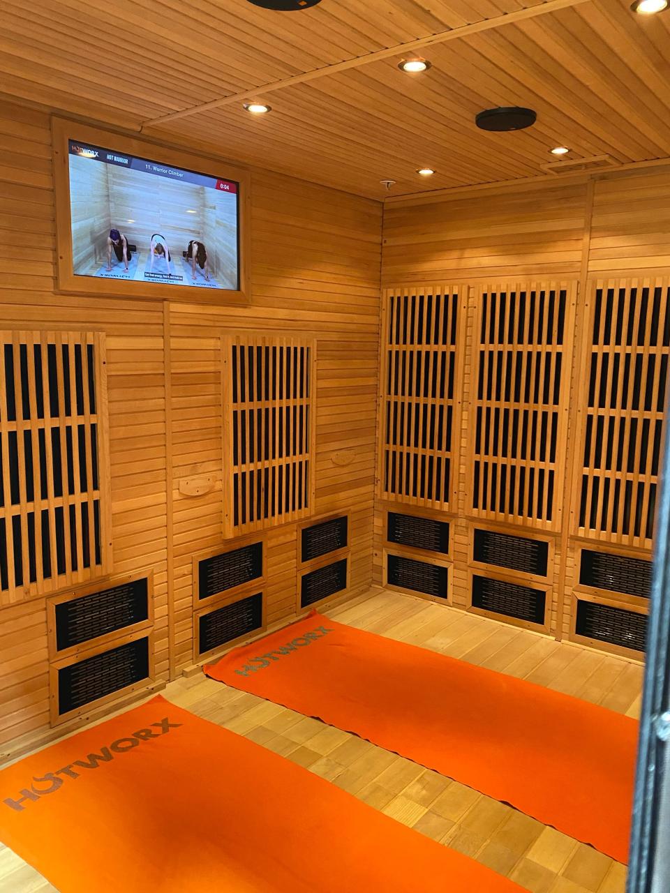 Hotworx studios are individual 9- to 12-foot cedar saunas that can be booked for a virtual infrared workout 24 hours a day, seven days a week.