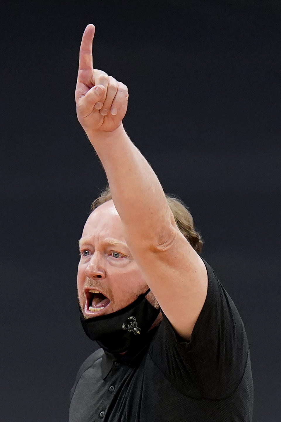 Milwaukee Bucks head coach Mike Budenholzer calls in a play during the second half of an NBA basketball game against the Toronto Raptors Wednesday, Jan. 27, 2021, in Tampa, Fla. (AP Photo/Chris O'Meara)