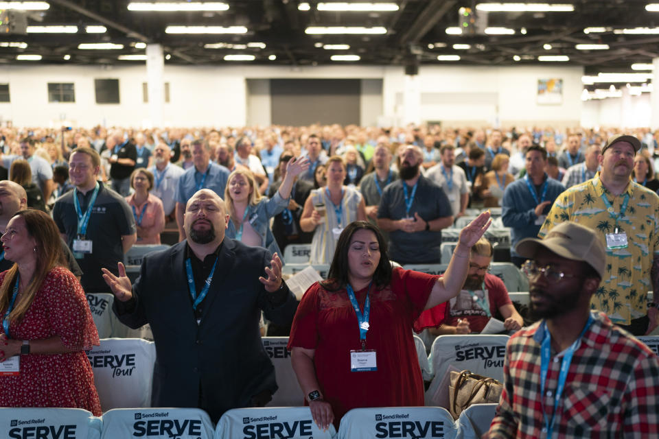 Attendees sing during a worship service at the Southern Baptist Convention’s annual meeting in Anaheim, Calif., Tuesday, June 14, 2022. (AP Photo/Jae C. Hong)