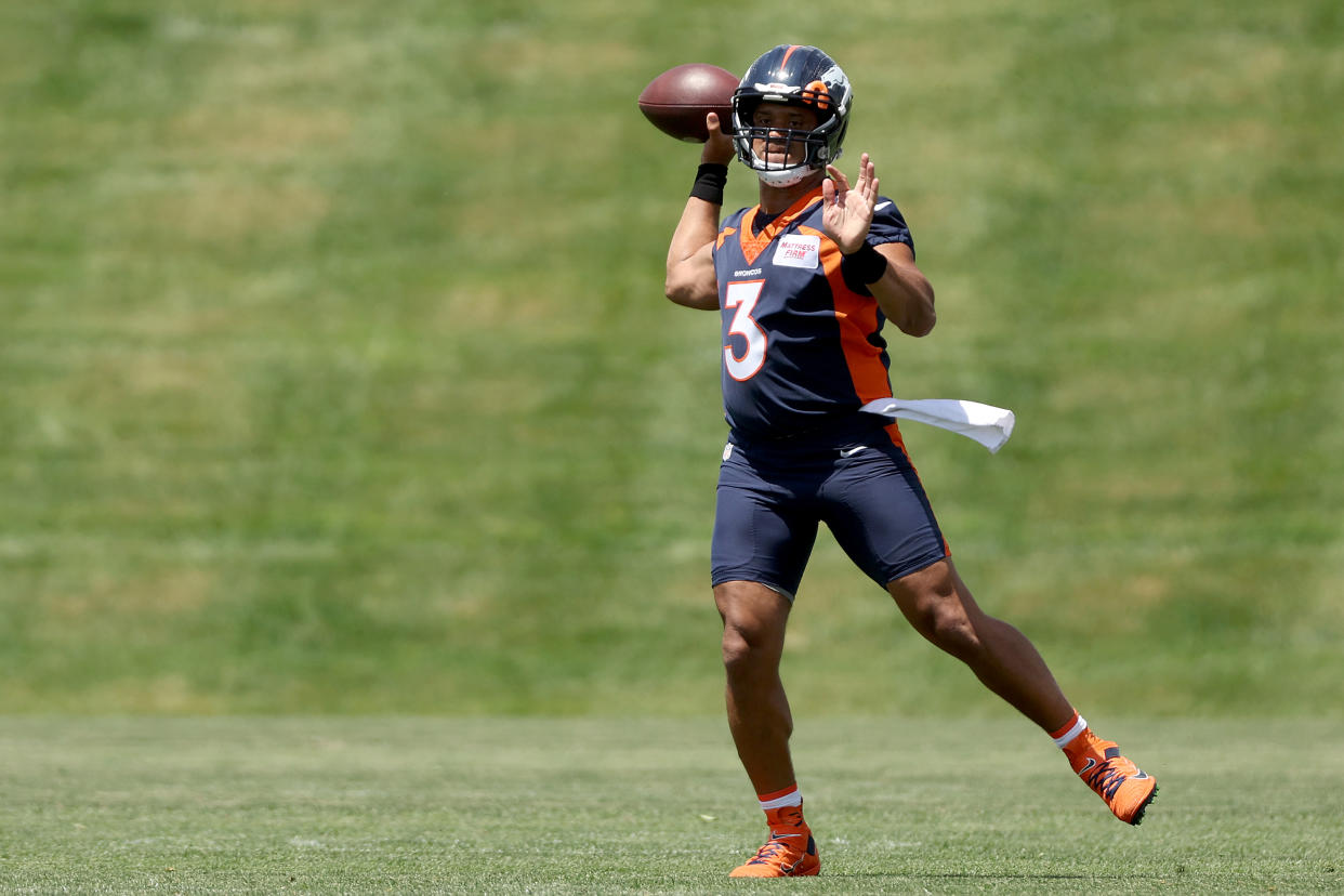 As NFL training camps begin, Russell Wilson, seen here in minicamp, will be starting his first season with the Denver Broncos. (Photo by Matthew Stockman/Getty Images)