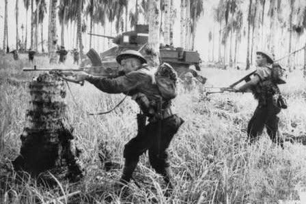 Australian-manned M3 General Stuart tanks attack Japanese pillboxes in the final assault on Buna, Papua New Guinea, on January 2, 1943. On January 22, 1943, U.S. and Australian troops took New Guinea in the first land victory over the Japanese in World War II. File Photo by George Silk/Australian government
