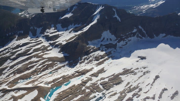 <span class="article__caption">Sperry Glacier in Glacier National Park seen from the air (from a non-sightseeing aircraft) </span>(Photo: Courtesy <a href="https://ecoflight.org/" rel="nofollow noopener" target="_blank" data-ylk="slk:EcoFlight);elm:context_link;itc:0;sec:content-canvas" class="link ">EcoFlight)</a>