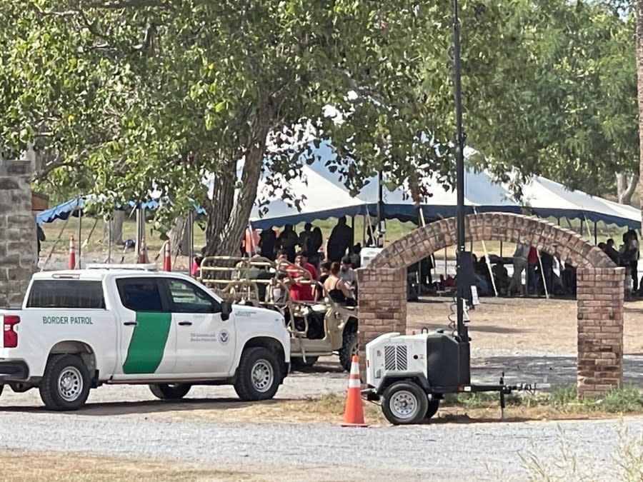 Border Patrol process migrants under a tent on Oct. 1, 2023, in Brownsville, Texas. (Sandra Sanchez/Border Report Photos)