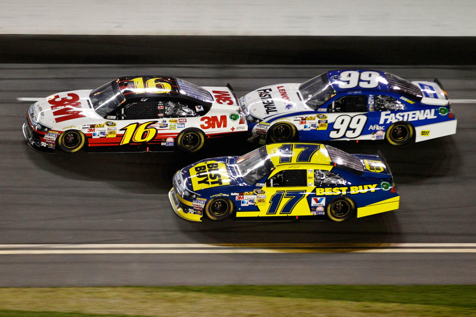 DAYTONA BEACH, FL - FEBRUARY 27: Greg Biffle, driver of the #16 3M Ford, Carl Edwards, driver of the #99 Fastenal Ford, and Matt Kenseth, driver of the #17 Best Buy Ford, race during the NASCAR Sprint Cup Series Daytona 500 at Daytona International Speedway on February 27, 2012 in Daytona Beach, Florida. (Photo by Streeter Lecka/Getty Images)