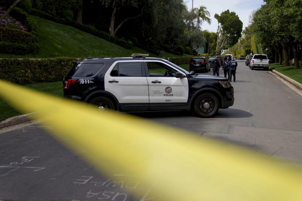 Police tape blocks a street in front of a property belonging to Sean "Diddy" Combs on Monday, March 25, 2024, in Los Angeles. Two properties belonging to Combs in Los Angeles and Miami were searched Monday by federal Homeland Security Investigations agents and other law enforcement as part of an ongoing sex trafficking investigation by federal authorities in New York, two law enforcement officials told The Associated Press. (AP Photo/Eric Thayer)