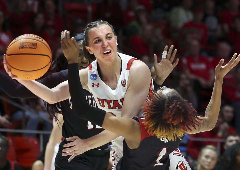 Utah Utes guard Kennady McQueen (24) gets off a pass while taking down Gardner-Webb Runnin’ Bulldogs guard Ki’Ari Cain (1) during the NCAA First Round at the Jon M. Huntsman Center in Salt Lake City on Friday, March 17, 2023. | Laura Seitz, Deseret News