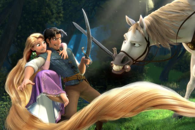 <p>Disney</p> Rapunzel (Mandy Moore), Flynn Rider (Zachary Levi), and Maximus in 'Tangled'