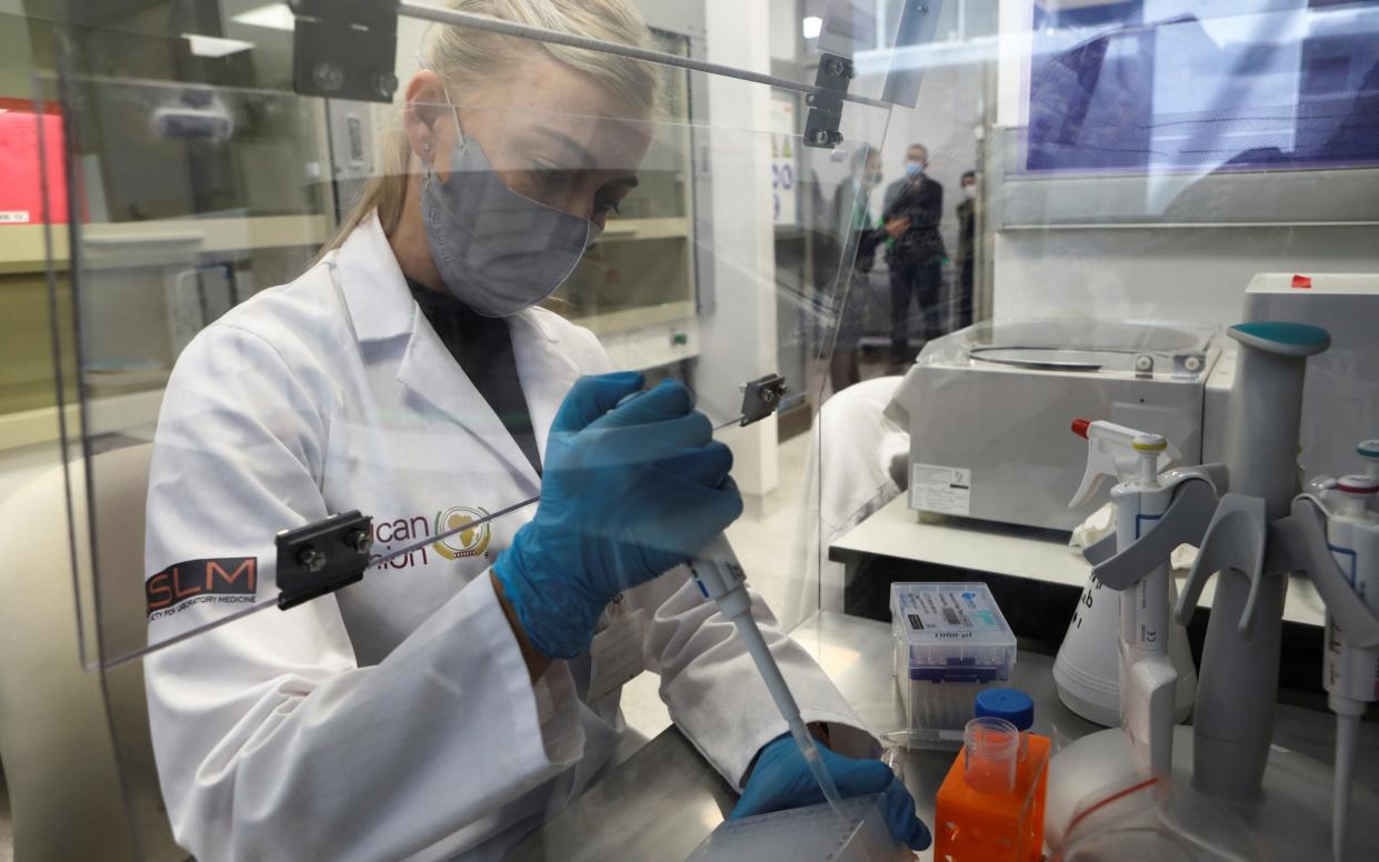 A molecular Biologists prepares samples during the site visit by representatives of the Medicines Patent Pool, France and other European Union member states, at the Centre for Educational Research and Innovation (CERI) in Cape Town, South Africa - Shelley Christians/REUTERS