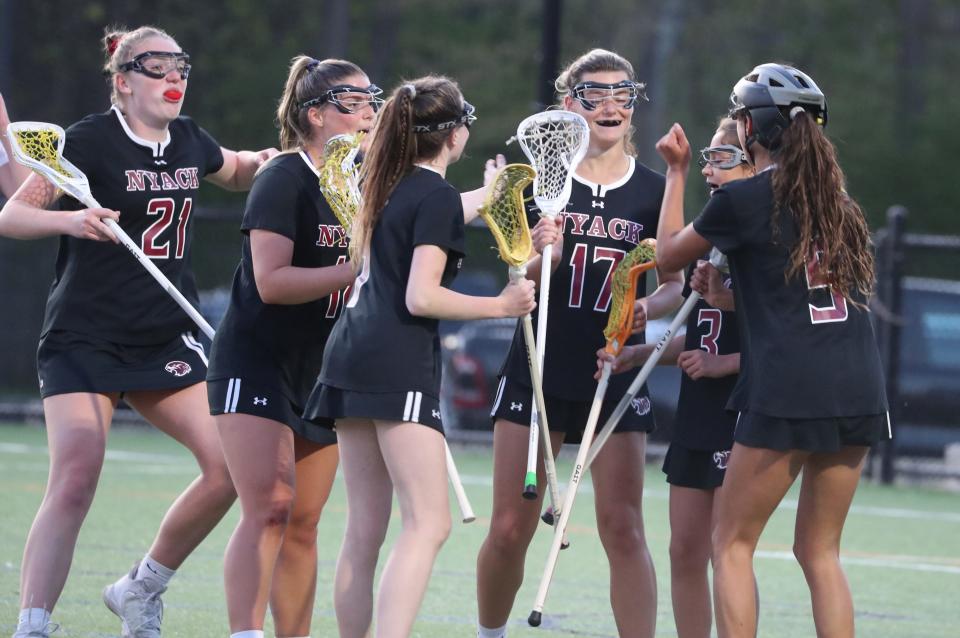 Nyack players celebrate a goal by Kayleigh Cassidy during a game at Horace Greeley April 25, 2023. Nyack won 16-6.