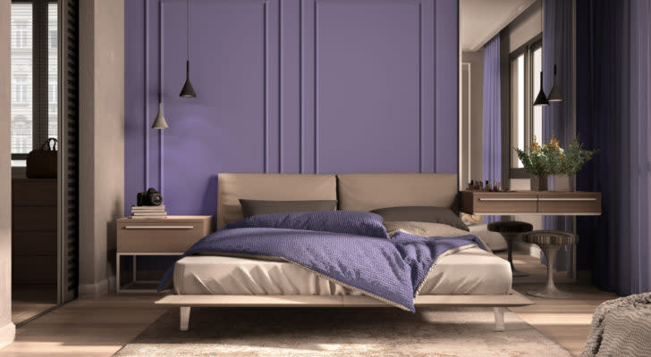 Minimal classic bedroom in purple tones with walk-in closet, double bed with duvet and pillows, side tables with lamps, carpet. Parquet and stucco walls, luxury interior design idea, 3d illustration. PRPL stock