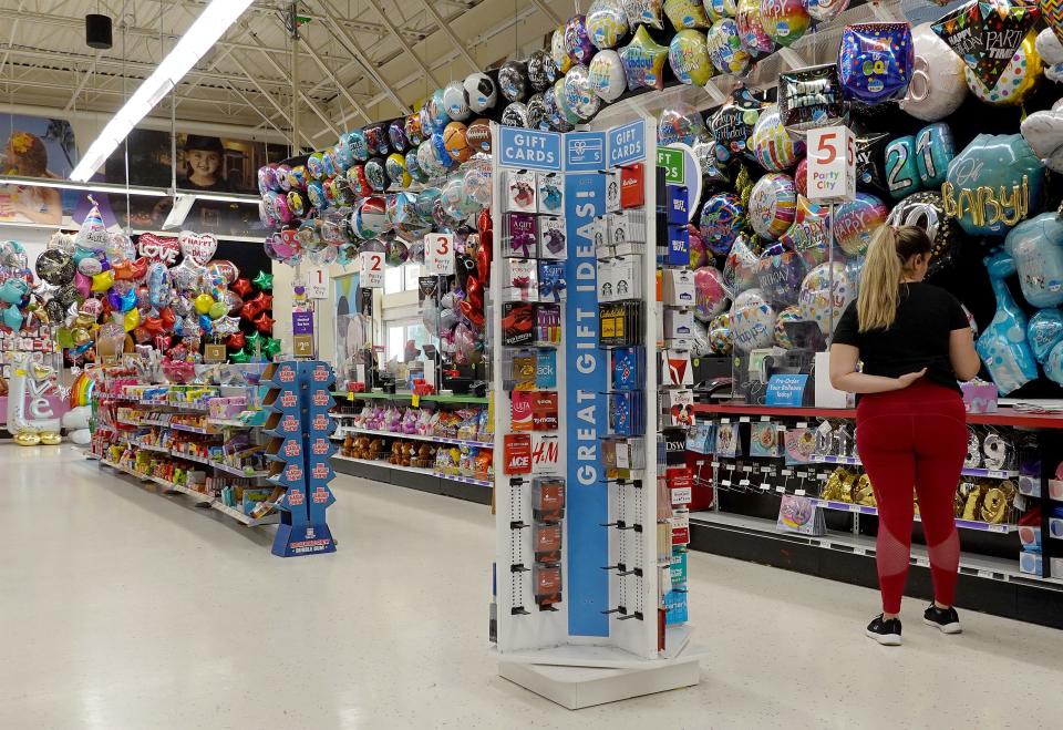Woman shops for balloons at Party City
