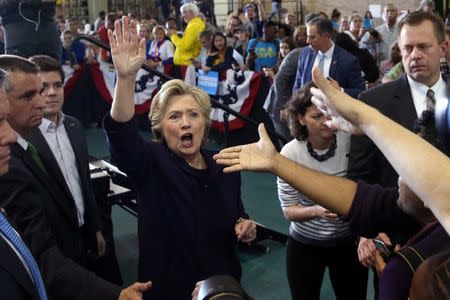 U.S. Democratic presidential nominee Hillary Clinton waves to supporters after speaking at a voter registration rally at Wayne State University in Detroit, Michigan, U.S. October 10, 2016. REUTERS/Lucy Nicholson