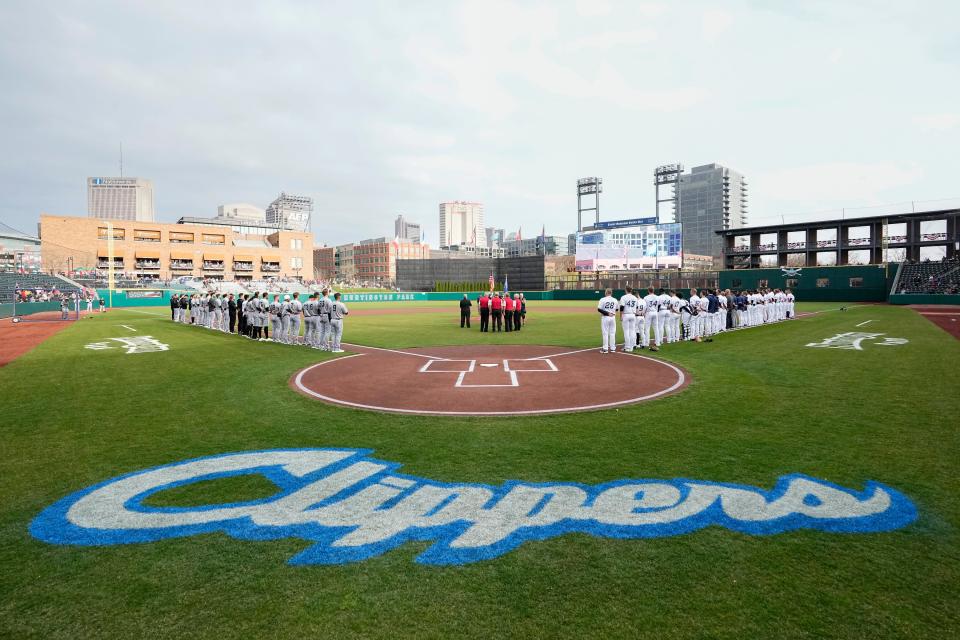 Columbus Clippers and Charlotte Knights line up for the National Anthem prior to the MILB opening night baseball game at Huntington Park on April 4, 2023.