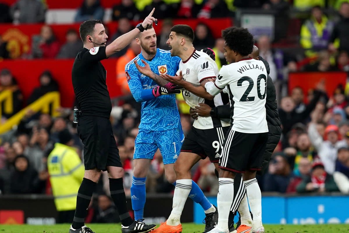 Fulham’s Aleksandar Mitrovic (centre) is sent off by referee Chris Kavanagh during the Emirates FA Cup quarter-final match at Old Trafford, Manchester. Picture date: Sunday March 19, 2023. (PA Wire)
