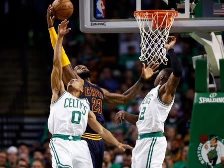 May 25, 2017; Boston, MA, USA; Cleveland Cavaliers forward LeBron James (23) attempts a layup in front of Boston Celtics guard Avery Bradley (0) and guard Terry Rozier (12) during the second quarter of game five of the Eastern conference finals of the NBA Playoffs at the TD Garden. Mandatory Credit: Greg M. Cooper-USA TODAY Sports