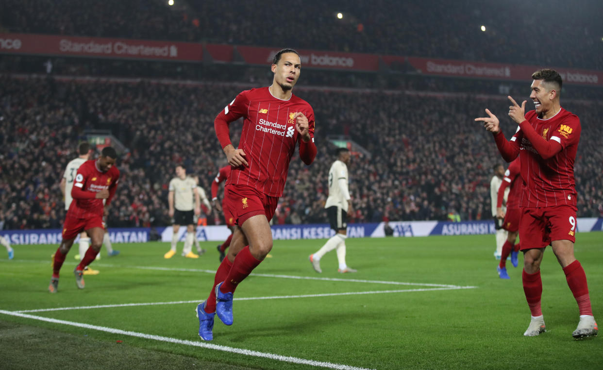 Soccer Football - Premier League - Liverpool v Manchester United - Anfield, Liverpool, Britain - January 19, 2020   Liverpool's Virgil van Dijk celebrates scoring their first goal with Roberto Firmino   Action Images via Reuters/Carl Recine    EDITORIAL USE ONLY. No use with unauthorized audio, video, data, fixture lists, club/league logos or "live" services. Online in-match use limited to 75 images, no video emulation. No use in betting, games or single club/league/player publications.  Please contact your account representative for further details.