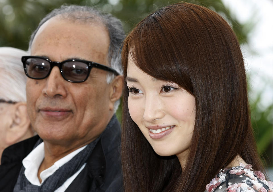 Director Abbas Kiarostami, left and actress Rin Takanashi pose during a photo call for Like Somone in Love at the 65th international film festival, in Cannes, southern France, Monday, May 21, 2012. (AP Photo/Lionel Cironneau)