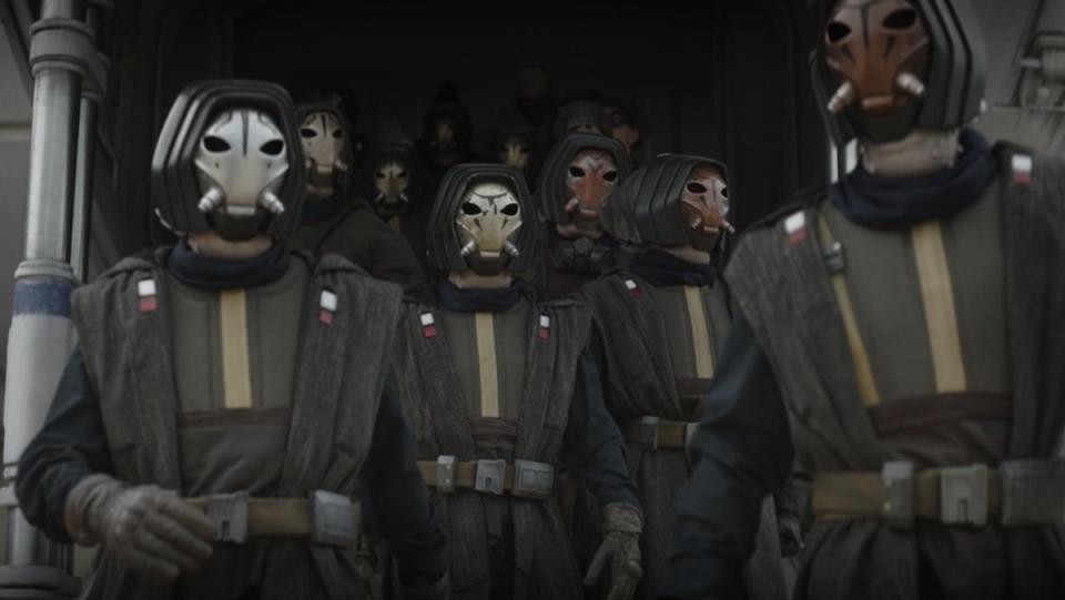 Masked members of the Pyke Syndicate walk off a spaceship on The Book of Boba Fett