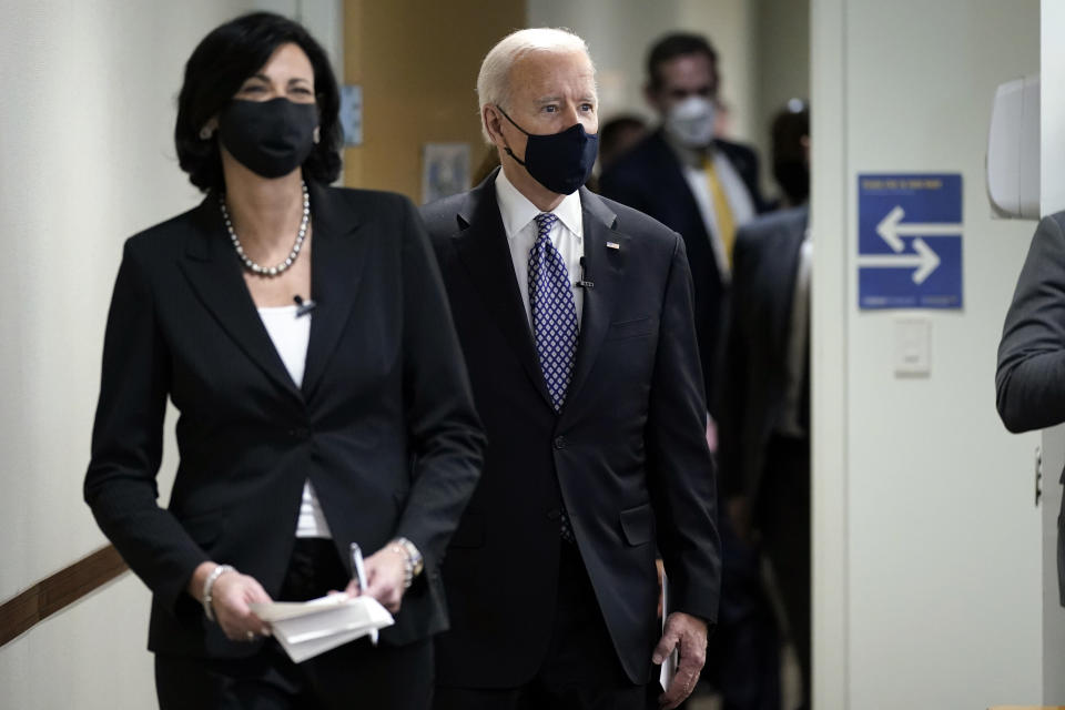 In this March 19, 2021, photo, Dr. Rochelle Walensky, director of the Centers for Disease Control and Prevention, leads President Joe Biden into the room for a COVID-19 briefing at the headquarters for the CDC Atlanta. Walensky is making an impassioned plea to Americans not to let their guard down in the fight against COVID-19. She warned on March 29 of a potential “fourth wave” of the virus. (AP Photo/Patrick Semansky)