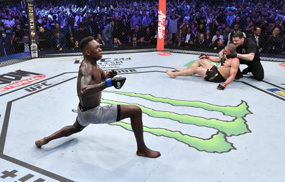 MELBOURNE, AUSTRALIA - OCTOBER 06:  Israel Adesanya of Nigeria celebrates after his knockout victory over Robert Whittaker of New Zealand in their UFC middleweight championship fight during the UFC 243 event at Marvel Stadium on October 06, 2019 in Melbourne, Australia. (Photo by Jeff Bottari/Zuffa LLC/Zuffa LLC via Getty Images)