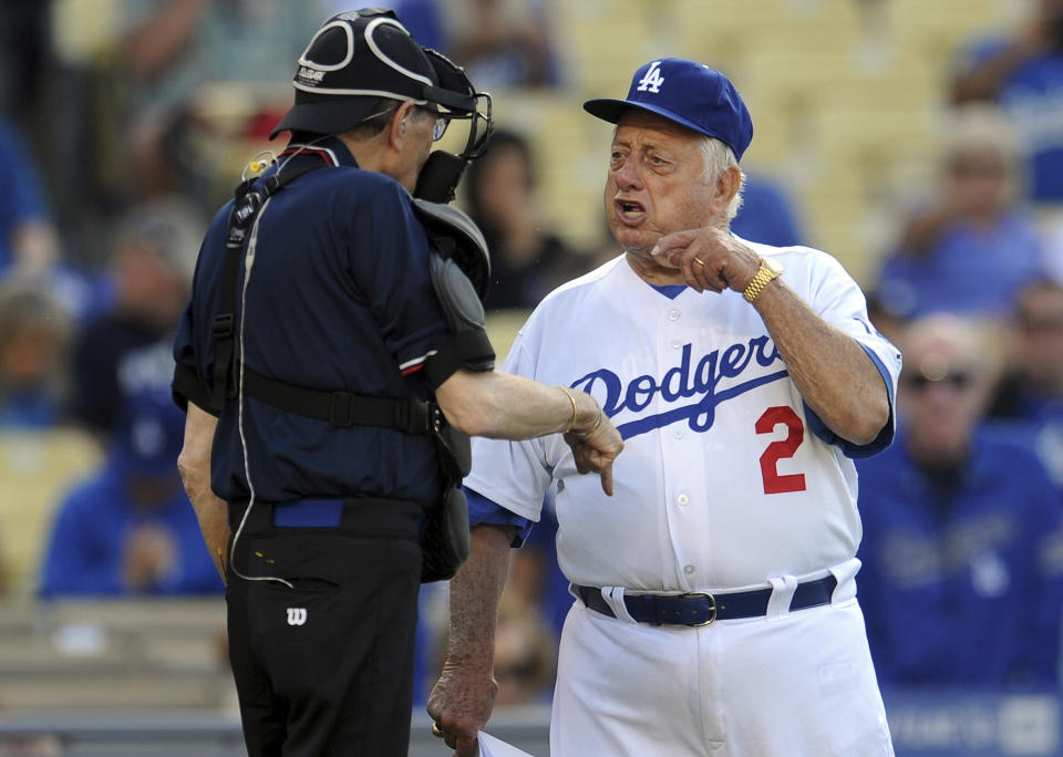 Hall of Fame and former Los Angeles Dodgers manager Tommy Lasorda passed away at the age of 93. Former Los Angeles Dodgers manger Tommy Lasorda argues with home plate umpire Larry King during the Old-Timers game prior to a baseball game between the Atlanta Braves and the Los Angeles Dodgers on Saturday, June 8, 2013 in Los Angeles. (Keith Birmingham/The Orange County Register via AP)