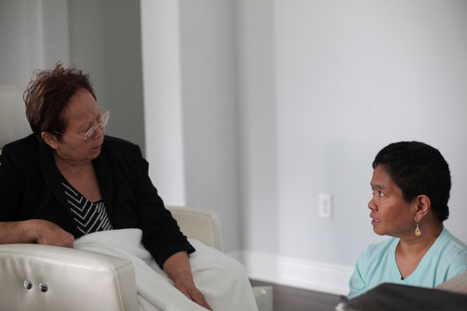 Supee Spindler speaks to her daughter, Nisarat Jittasonthi, Oct. 10, 2023, in their Vero Beach home.