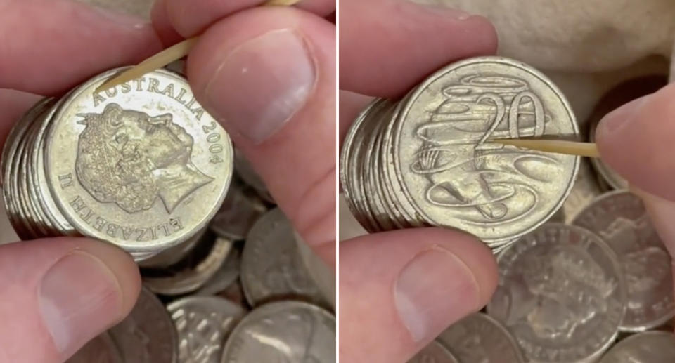 Michael McCauley inspects a 2004 Australian 20 cent coin and a 1966 20 cent coin.