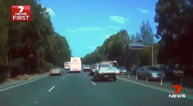 The vision shows the driver of a ute with Queensland number plates arguing with another motorist. Photo: 7 News