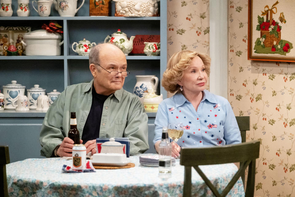 Red and Kitty Forman sitting at a table