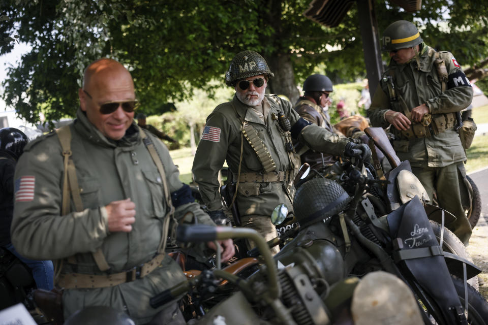 War enthusiasts ride vintage motorcycles after a ceremony at Pegasus Bridge, in Benouville, Normandy, Monday June 5, 2023. Dozens of World War II veterans have traveled to Normandy this week to mark the 79th anniversary of D-Day, the decisive but deadly assault that led to the liberation of France and Western Europe from Nazi control. (AP Photo/Thomas Padilla)
