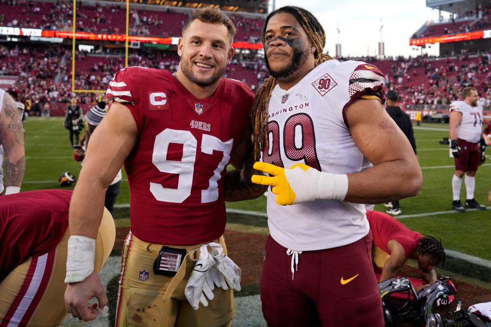 Chase Young (right) will reunite with fellow Ohio State Buckeye alum Nick Bosa (left) after a trade Tuesday.