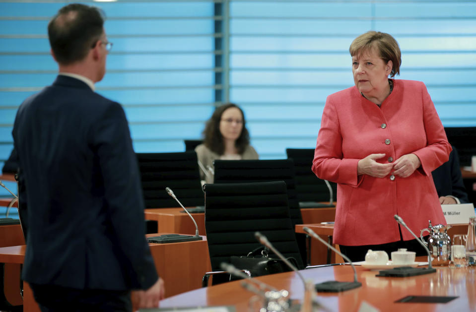 German Chancellor Angela Merkel, right, and German Foreign Minister Heiko Maas, right, attend the weekly cabinet meeting at the chancellery in Berlin, Germany, Wednesday, June 24, 2020. (Hannibal Hanschke/Pool Photo via AP)