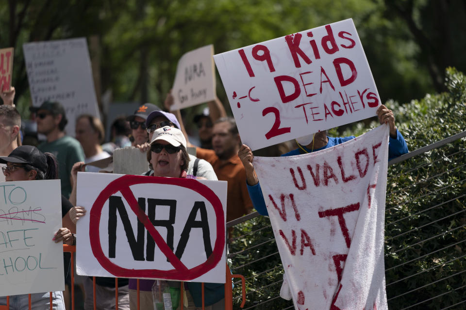 People protest the National Rifle Association's annual meeting in Houston, Friday, May 27, 2022. (AP Photo/Jae C. Hong)